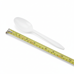 Close-up of white plastic spoon
