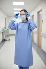 Healthcare professional wearing gown