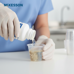 Healthcare worker measuring medication