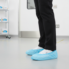 Healthcare worker wearing shoe covers