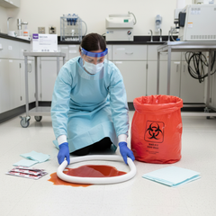 Healthcare Professional Using Biohazard Spill Kit