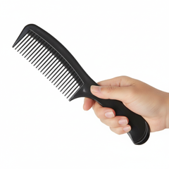Hand holding comb