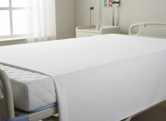 Sheet on fully made bed presentation