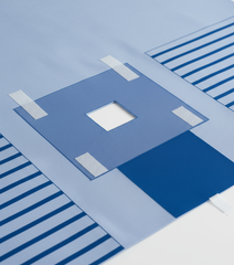 Close-up detail view of adhesive fenestration and absorbent reinforcement