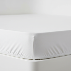 Sheet fitted on mattress corner