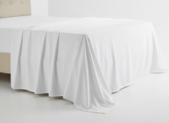 Sheet draped over bed corner