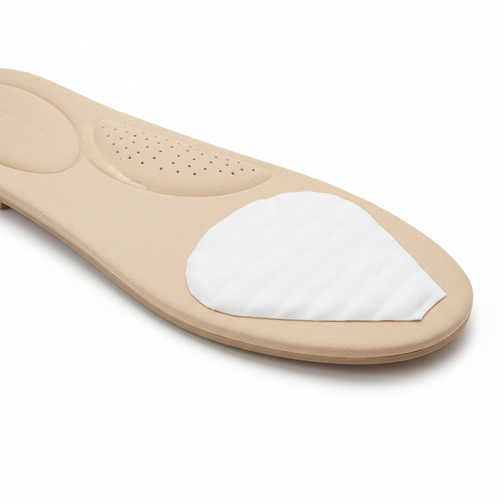 Pad positioned on shoe insole demonstrating placement