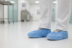 Shoe covers being worn