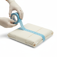 Tape being applied to sterilization package