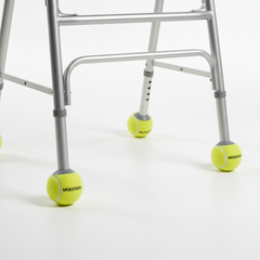 Tennis ball glides attached to walker legs