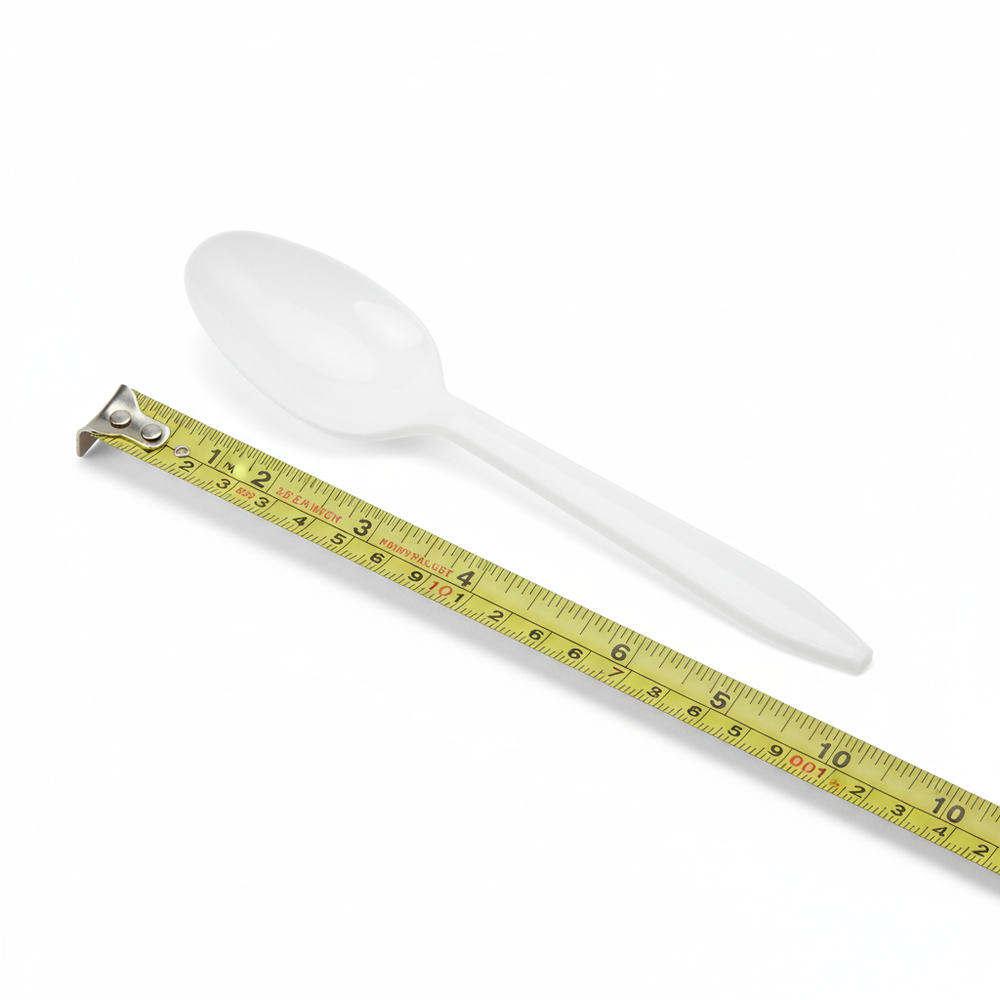 Close-up of white plastic spoon