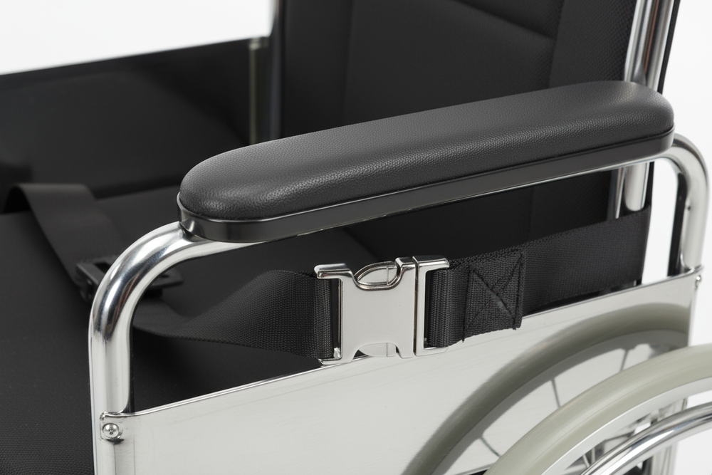Close-up of padded armrest and seat belt