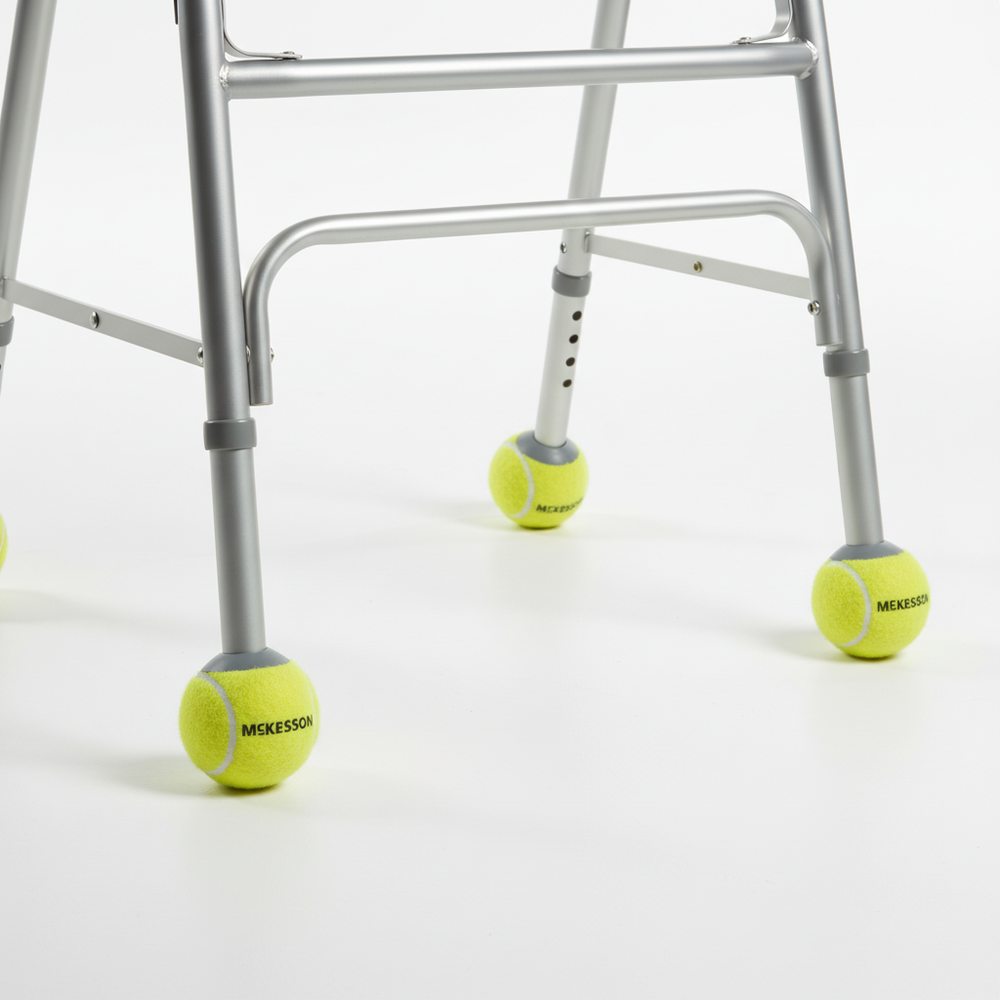 Tennis ball glides attached to walker legs